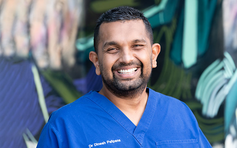 Dr Dinesh Palipana in blue hospital scrubs