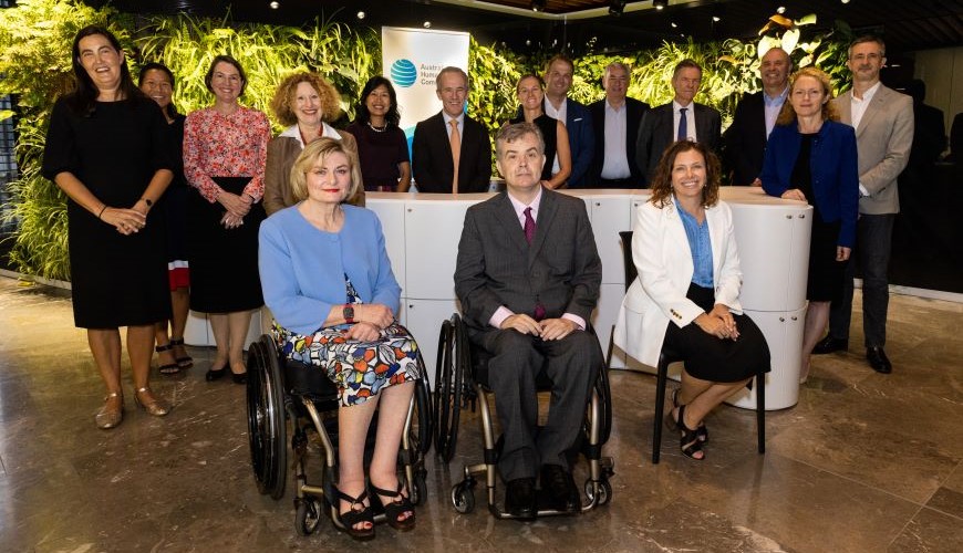 Senior Leaders at the Forum in front of the AHRC banner and plant wall. In the front row is COmmissioner Gauntlett, Jane Spring and Minister Rishworth  