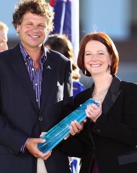 Image of Simon with Prime Minister Julia Gillard receiving the Australian of the Year award 