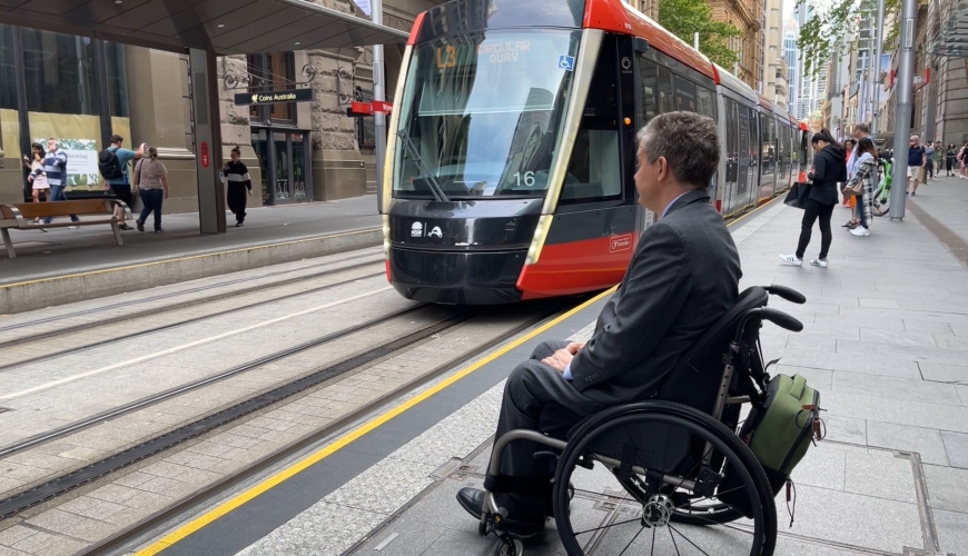 Ben Gauntlett waits for tram.